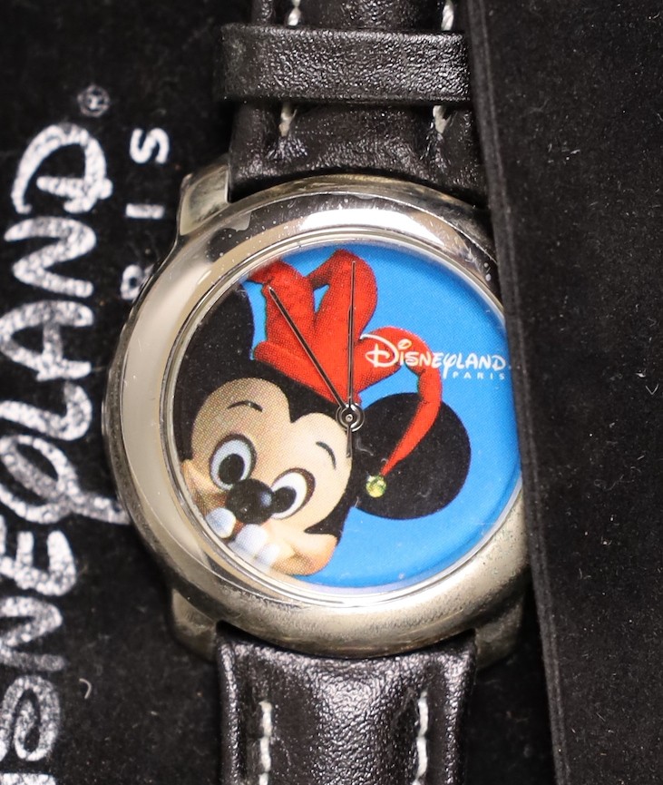 Assorted Walt Disney wristwatches including two commemorative Disney Cruise Line, 100 Years of Magic, Tarzan ride, California Adventure Park, opening of Space Mountain, Disneyland Paris (9 total)